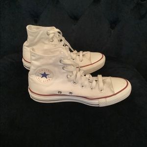 High top Converse tennis shoe